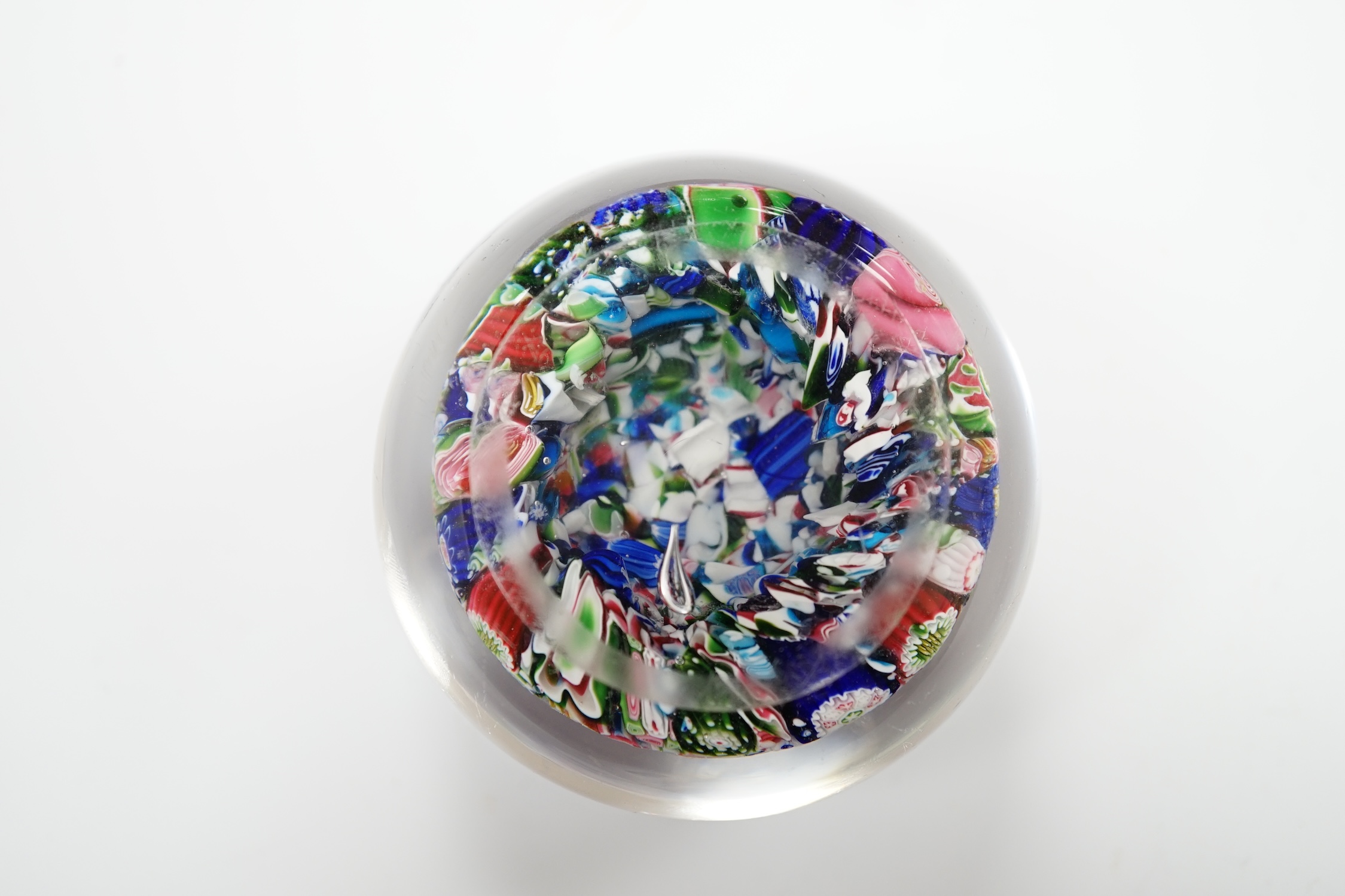 A Clichy scrambled glass paperweight with unusual pink and green rose, 6.5cm in diameter